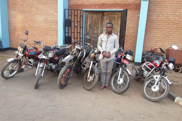 One of the suspected robbers and the recovered motorcycles 