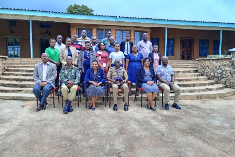 Participants and facilitators pose for a group photograph after the opening session